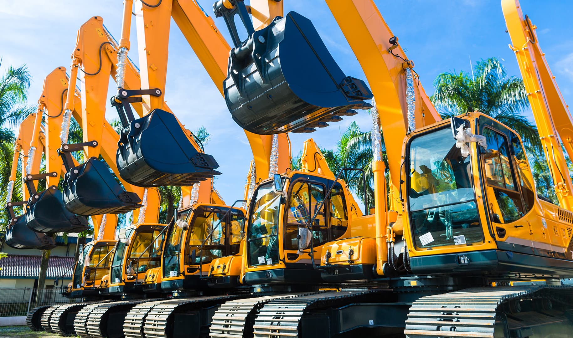 Row of excavators awaiting equipment financing